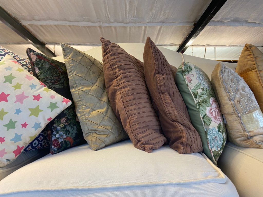 Cushions laid in a row on a sofa